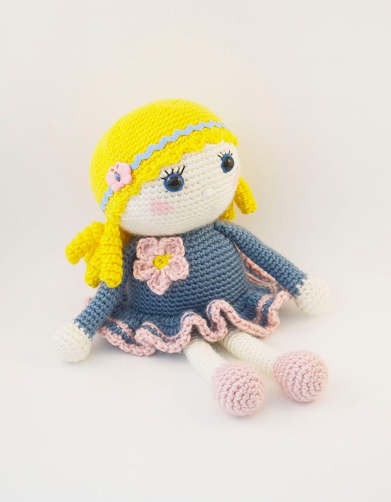 Amigurumi crochet doll Sweet little girl in a blue and pink