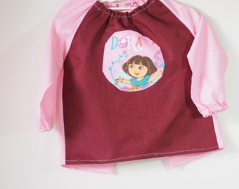 Art smock for toddler age 2 to 3 years. Burgundy and pink Dora.