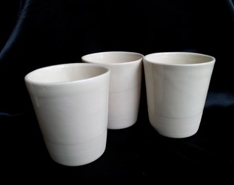 Beautiful slipcast porcelain mugs. Microwave safe.