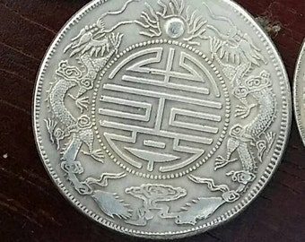 Large Chinese coin with dragons
