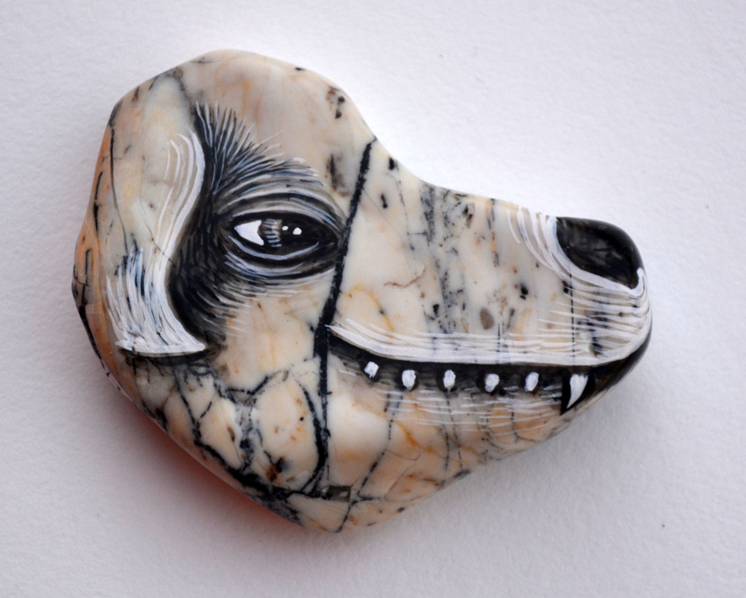Hand Painted Rock by Poxodd. One of a Kind Dog face by poxodd