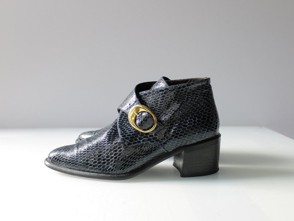 snakeskin boots with buckles