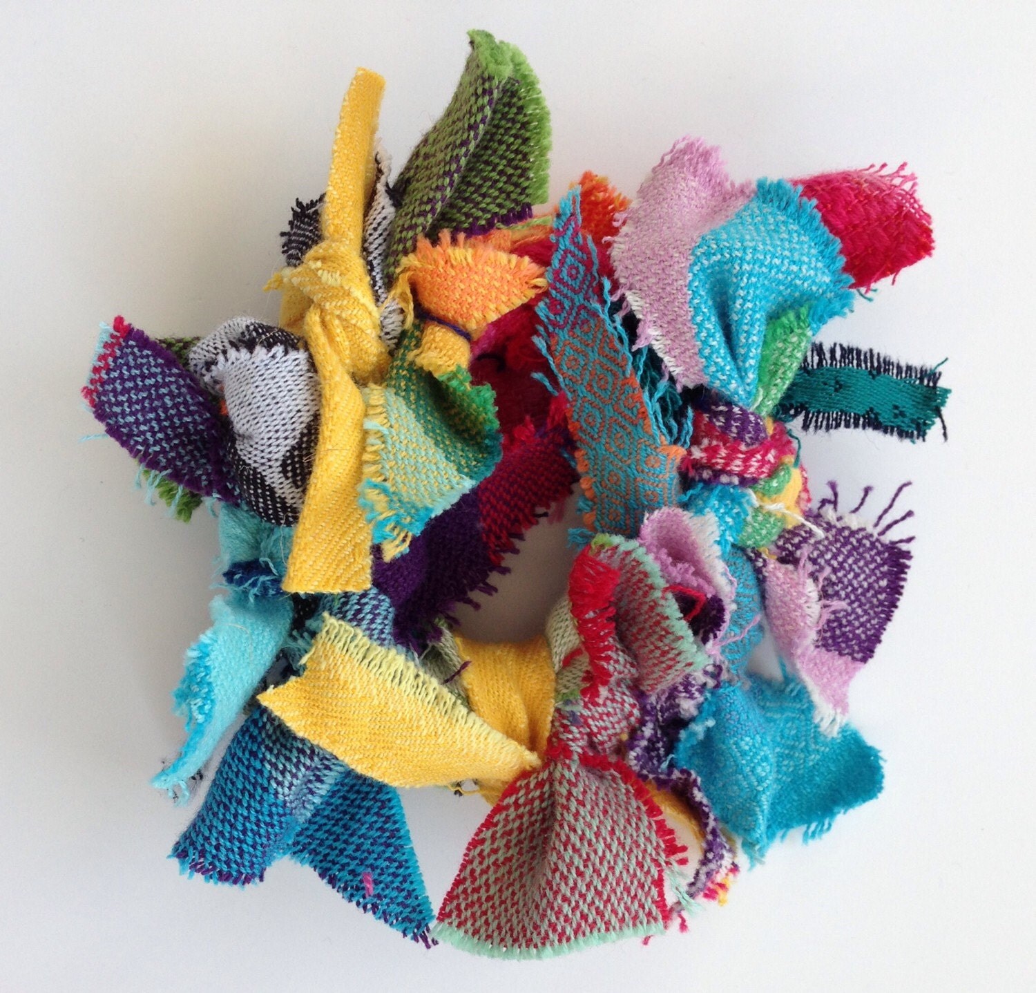 Wrap Scrap Wreath Ornament or Decoration, made from various colorful woven wrap scraps.