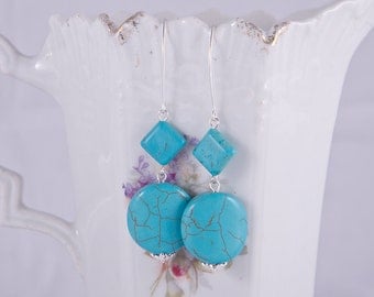 Elegant long sterling silver earrings with beautiful blue howlite turquoise stones, sterling silver spirals, marquis hooks, december stone