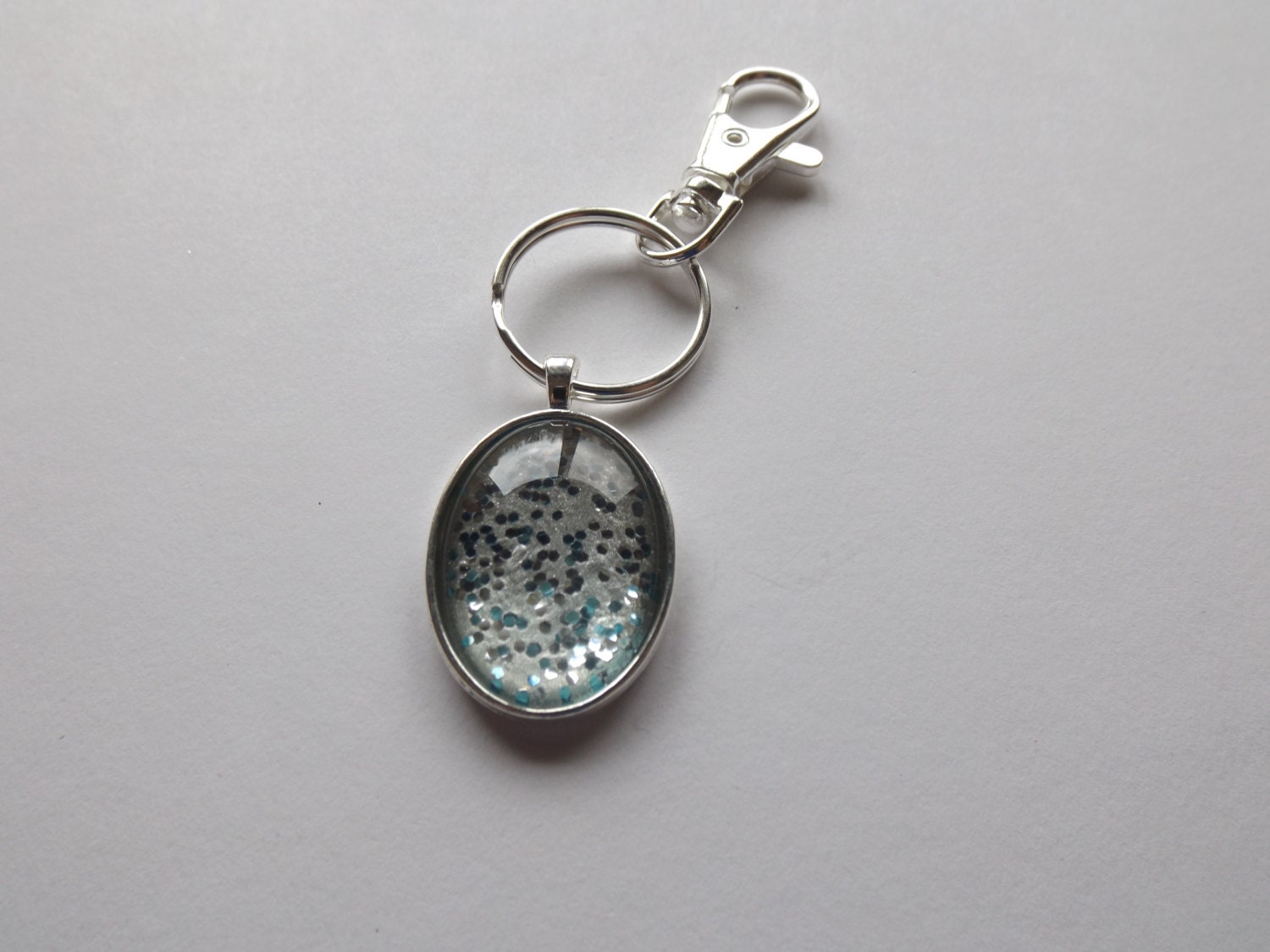 1 oval glitter key chain by Tokenstreasures on Etsy