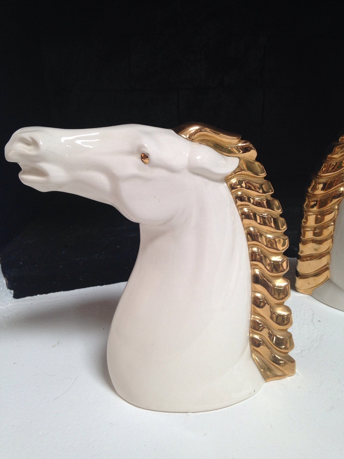 white ceramic horse statue