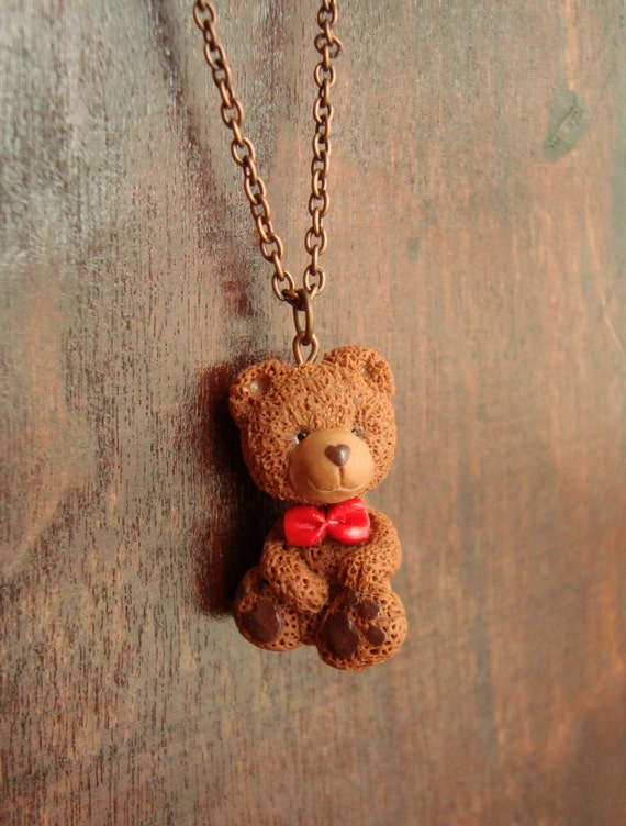 brown teddy bear with bow tie