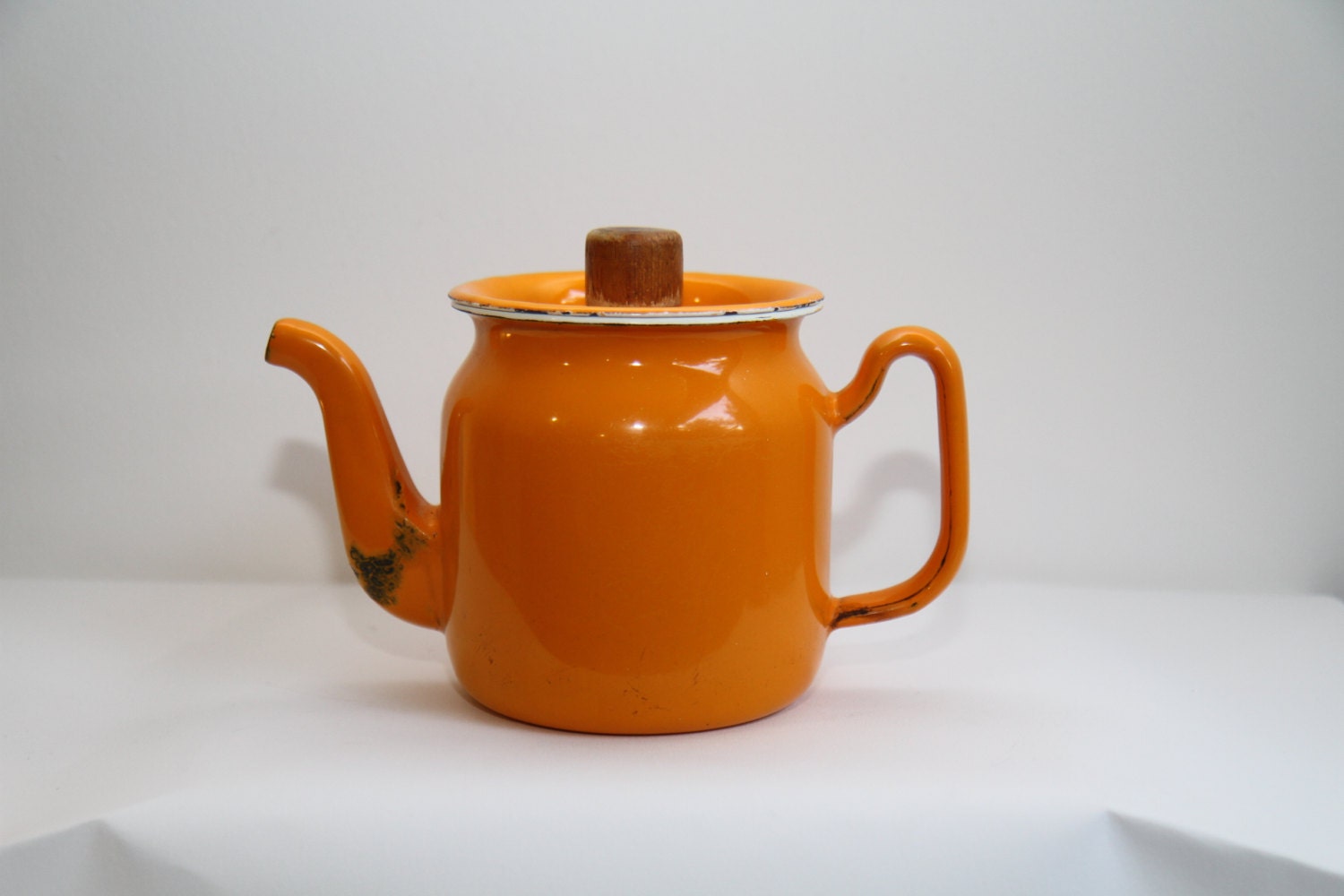 Orange enamelware kettle teapot and lid handle wood. by 10H01