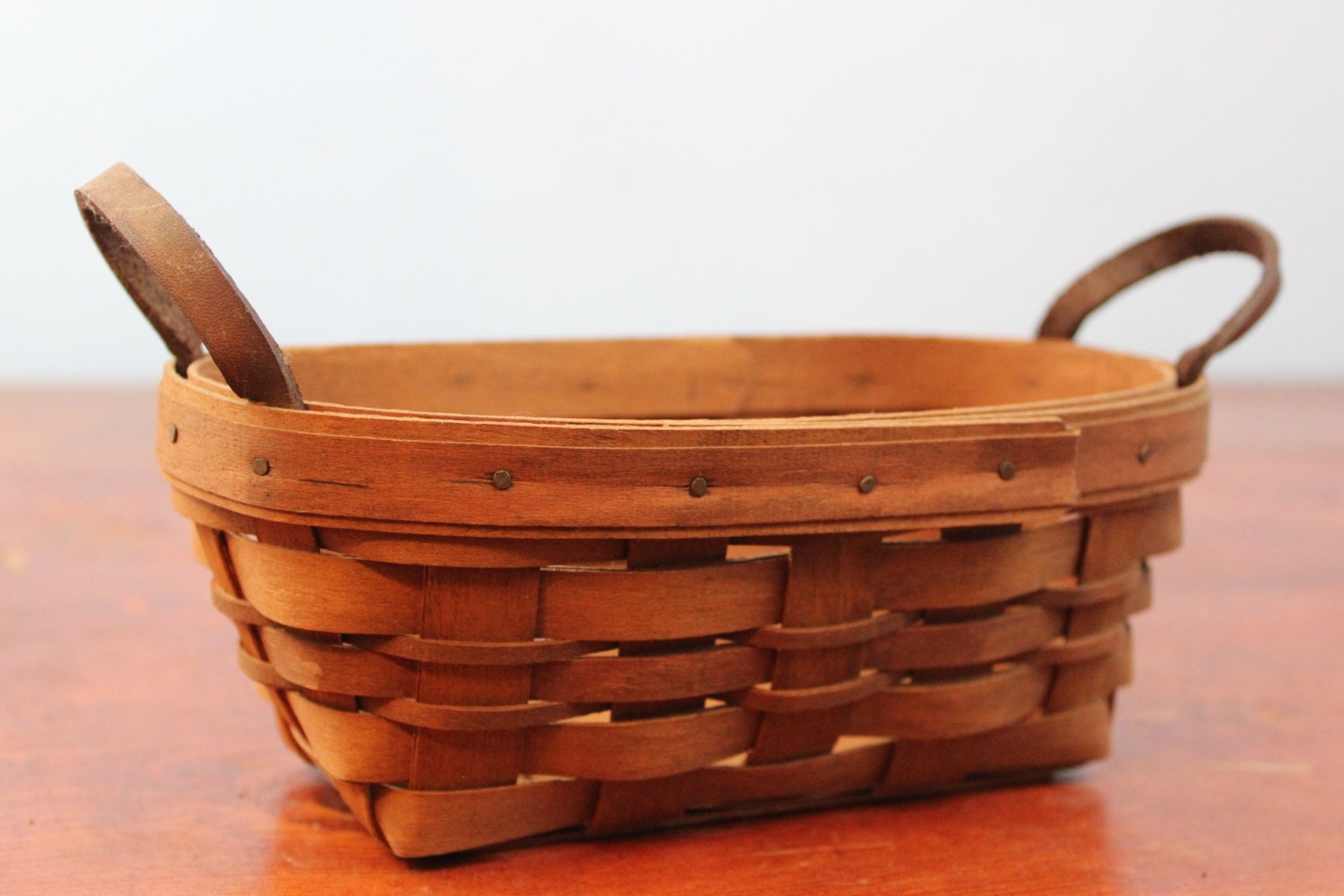 Collectible Longaberger tea Basket with two leather handles