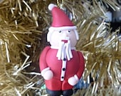 A festive Father Christmas Santa Claus fun novelty ornament or decoration for your Christmas Tree handmade with Fimo polymer clay