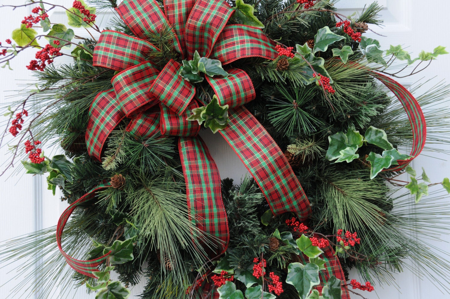 Christmas wreath with long needle pine ivy and plaid bow