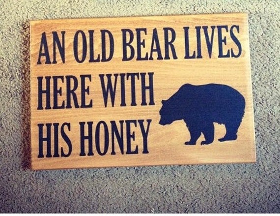 wood sign “old bear lives here with his honey”