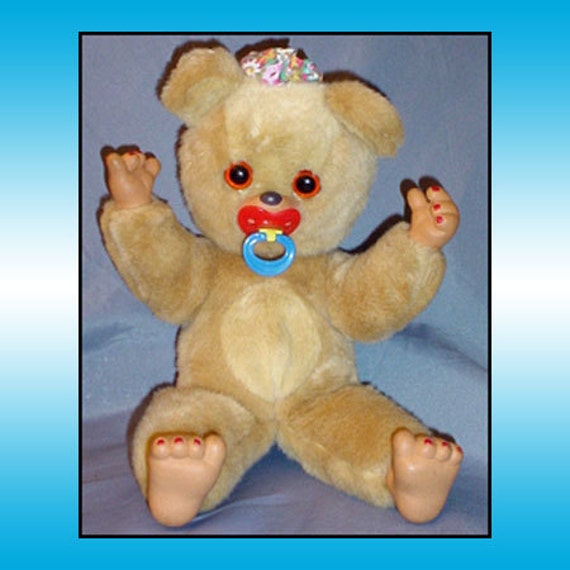 stuffed bear with pacifier