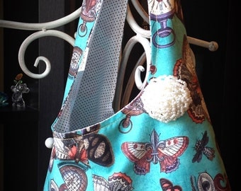 Steampunk tote. Knotted strap. Fully lined. Butterflies, timepieces, compasses, beetles. Orange, turquoise, faux pearl brooch/pin.