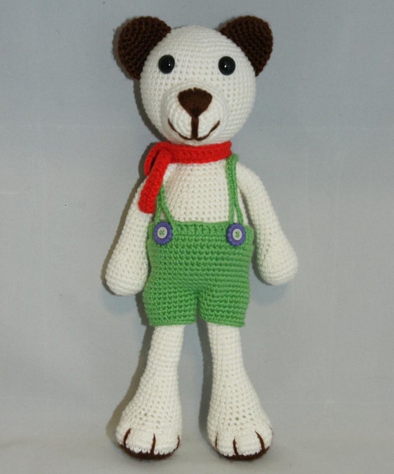 teddy bear with green overalls