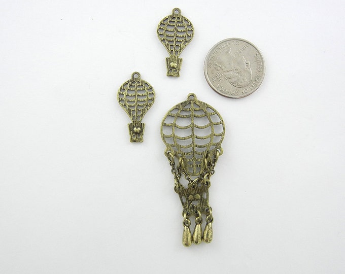 Set of Antique or Burnished Gold-tone Filigree Hot Air Balloon Pendant and Charms