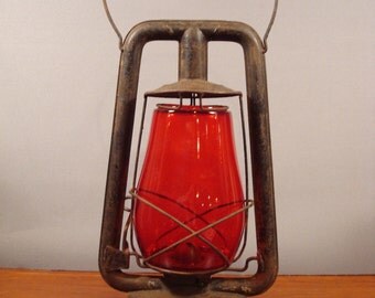 Nice vintage metal Embury Manufacturing Co. Barn Lamp with red glass globe