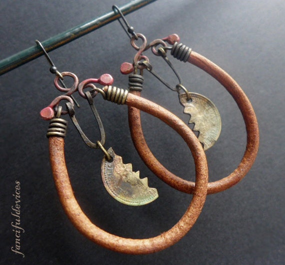 Abask. Rustic assemblage earrings with cut coins and leather cords.