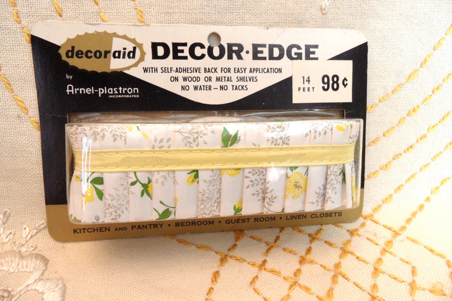 14 feet of pleated plastic shelf edging by Decor Edge.