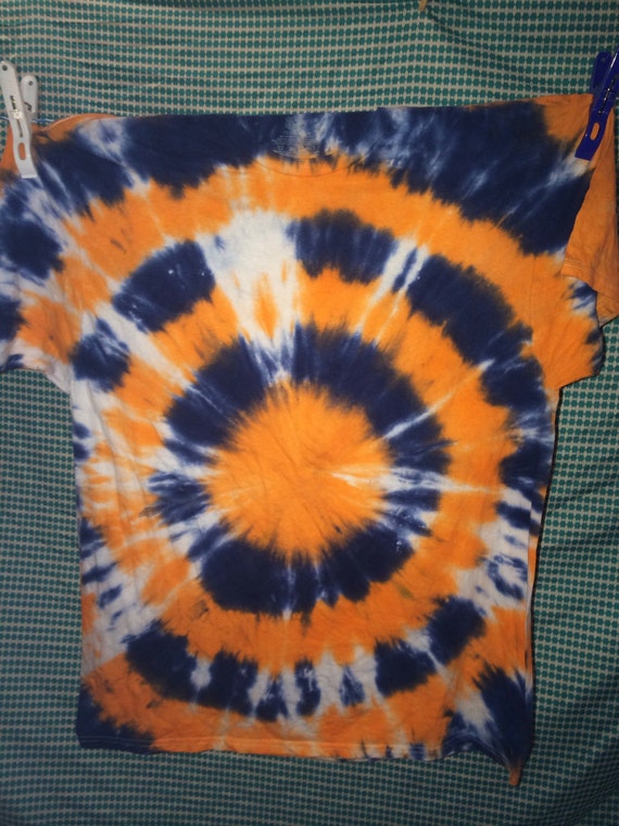 Orange and navy blue dot tie dye shirt.