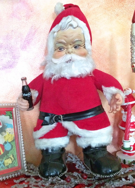 vintage stuffed santa holding coke bottle