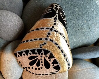 Golden Tribal Bell / painted rock / Sandi Pike Foundas / Sea stone from Cape Cod