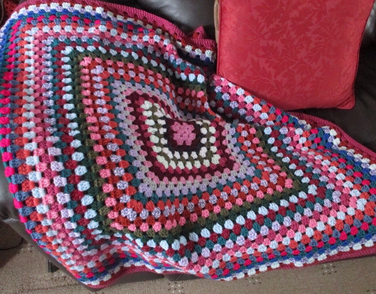 Crocheted granny square lap blanket