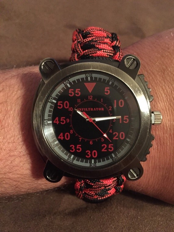 Paracord survival bracelet with watch whistle buckle fire