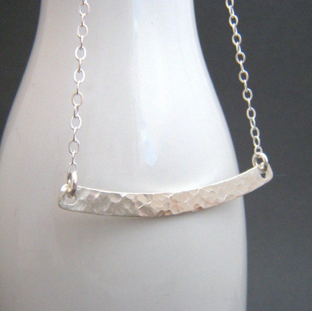long silver curved bar necklace. simple curve. geometric