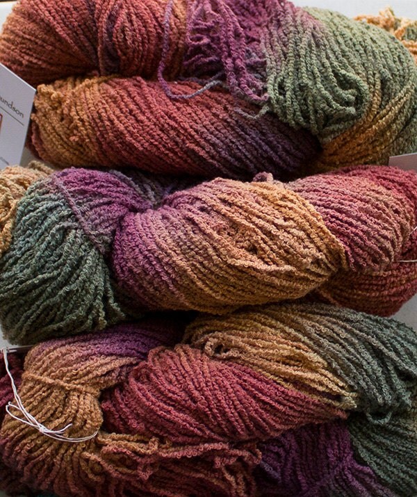 Create Your Etsy Account This auction is for an approximately 1 pound 12 ounce cone of Gorgeous Cotton Puff Smoke Boucle yarn in a vibrant Natural with a Blue wrap color. It was manufactured in the USA. It's a bulky weight at approximately yards per pound.