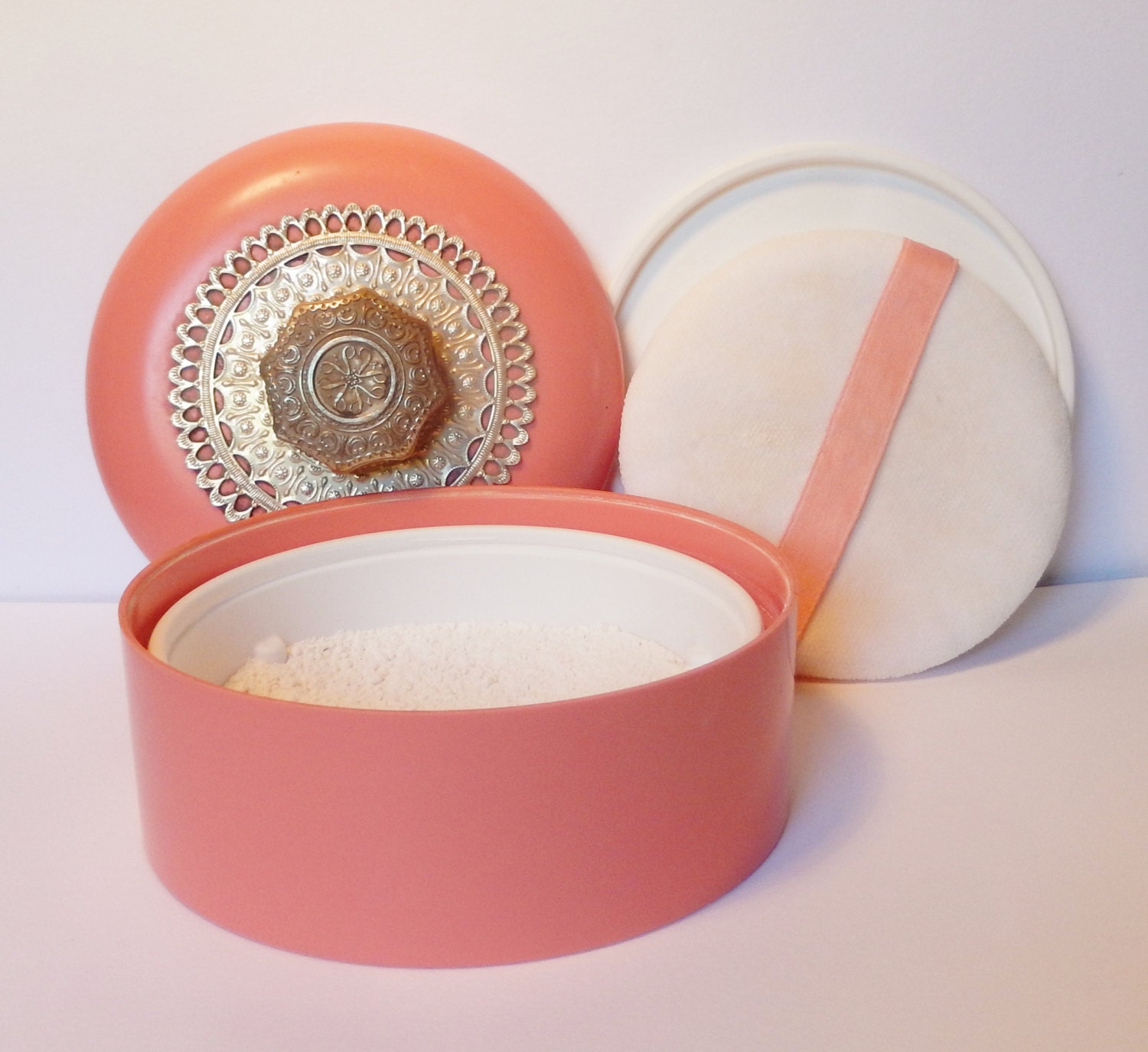 Vintage Avon talc in a pink powder container