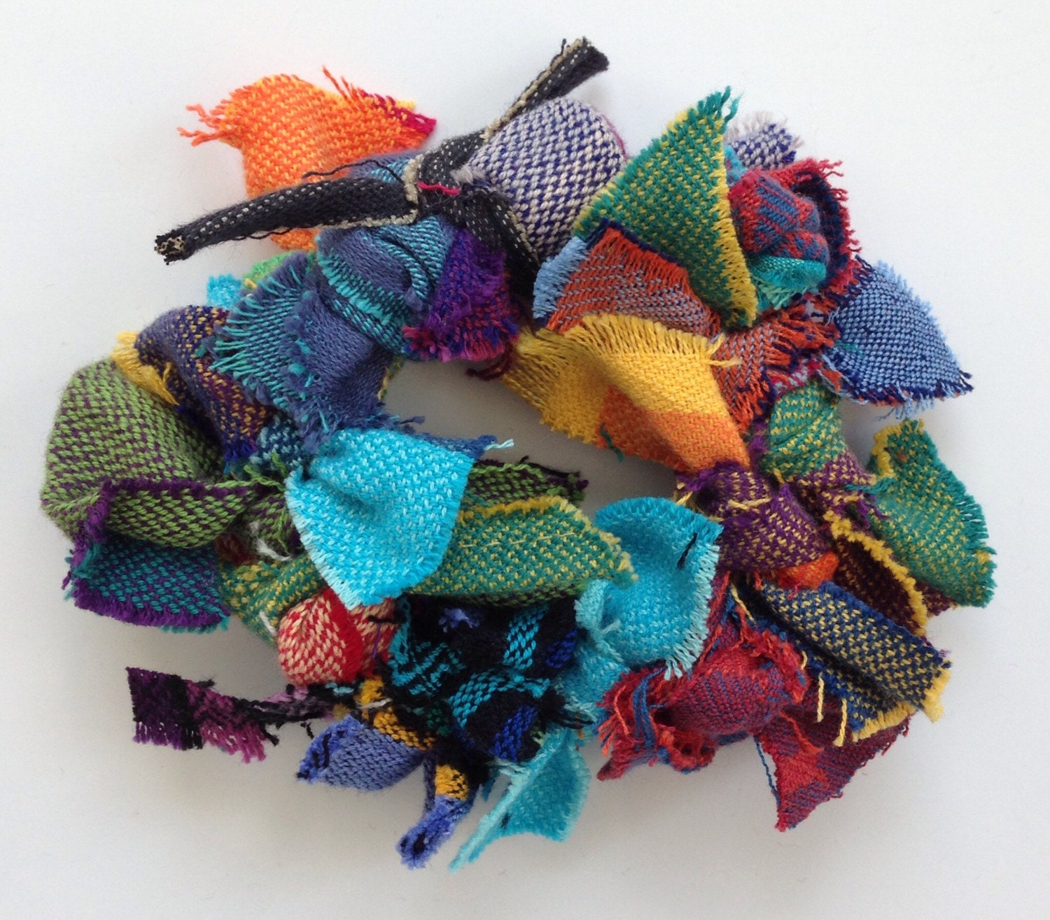 Wrap Scrap Wreath Ornament or Decoration, made from various colorful woven wrap scraps.
