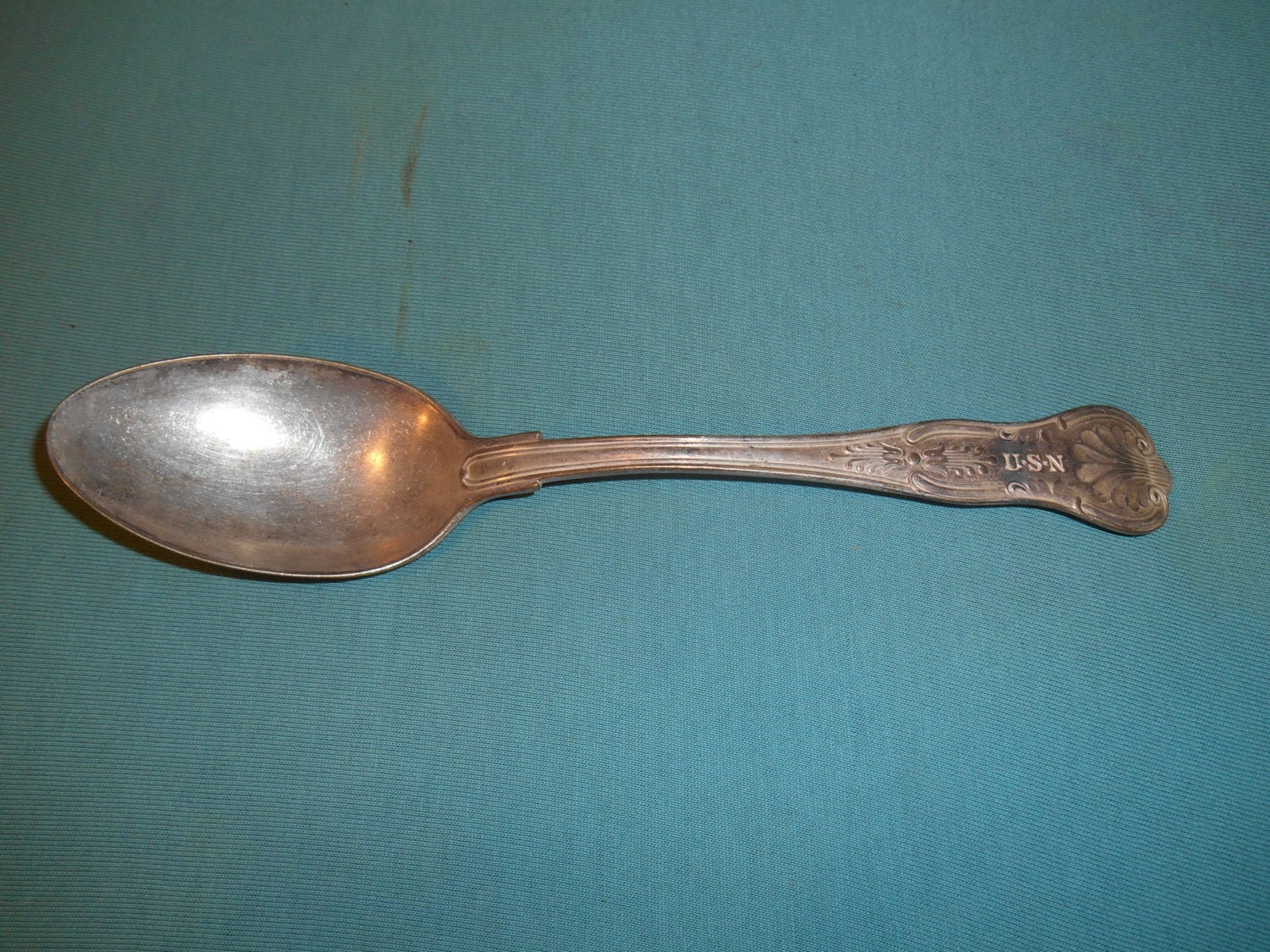 One (1), 8 1/2″ Silver Plated, Tablespoon (serving spoon) from