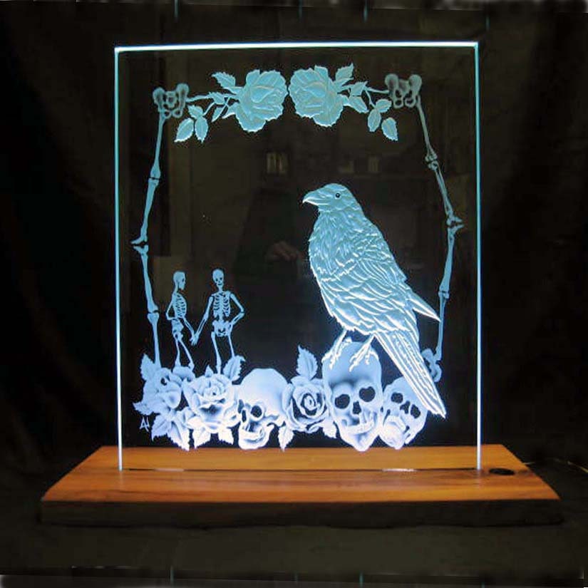 Edge lit carved and etched glass panel with 1 bevel in