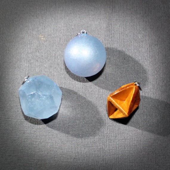 Items similar to Pokemon inspired Timespace orb pendants