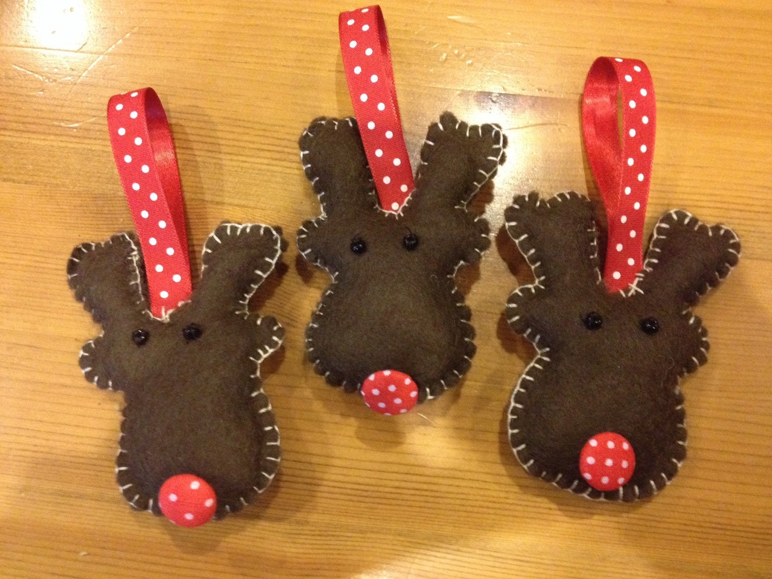 Set of three felt reindeer christmas decorations