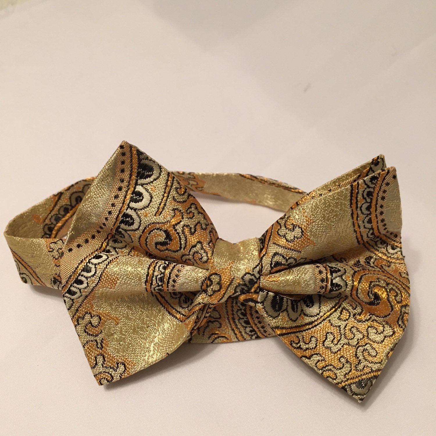 black-and-gold-paisly-bow-tie