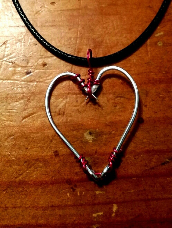 Items similar to Heart shaped fish hooks wire wrapped with a Leather