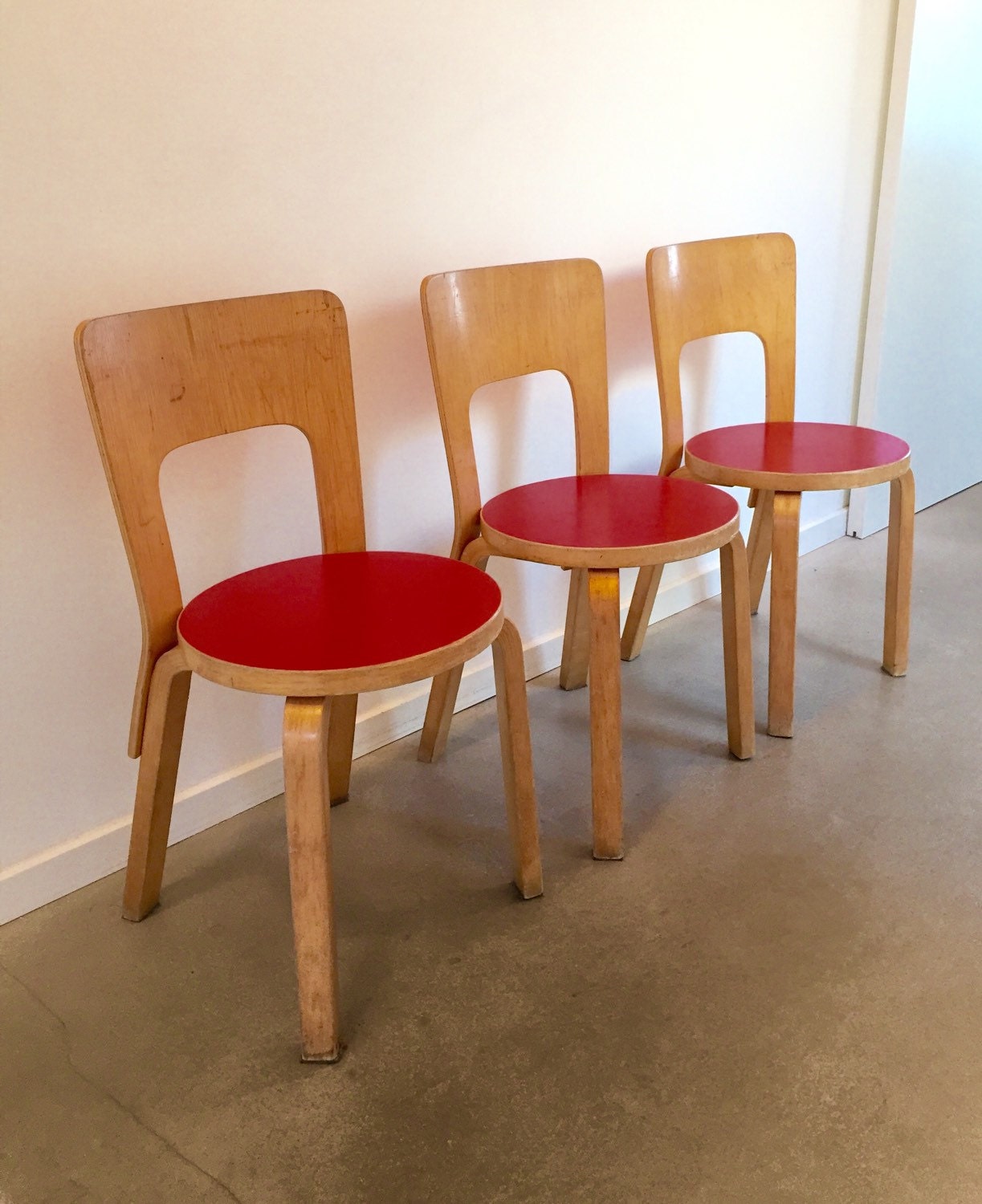 Vintage Alvar Aalto chairs 66 with red vinyl seat Haute Juice