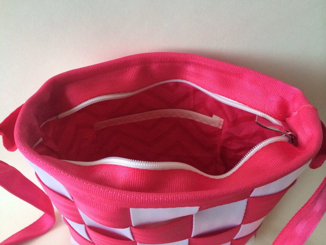 Seatbelt messenger bag in hot pink and white with zipper
