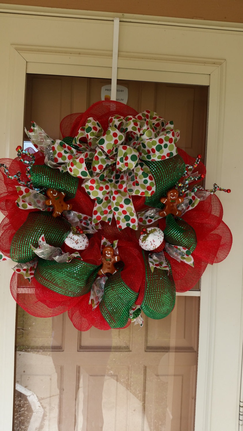Deco Mesh Christmas Wreath. red, green, multi color silk wired ribbon used. gingerbread men and cupcake decorations added.