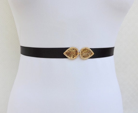 Black Elastic Waist Belt. Gold filigree leaf buckle.