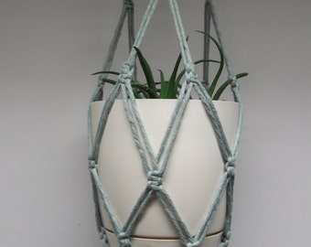 Faded cyan (bluish green) cotton macrame plant hanger. Flowerpot hanger