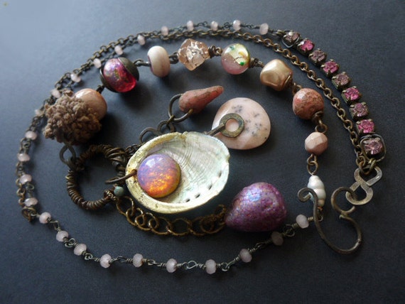 Abditive. Rustic assemblage necklace in shades of pink with vintage glass opal and seashell.