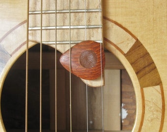 Exotic Lace wood guitar pick with leather friction pads.