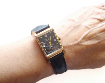 ... Watch Scalloped Case, Flared Lugs in 10kt Gold Fill Black Dial and