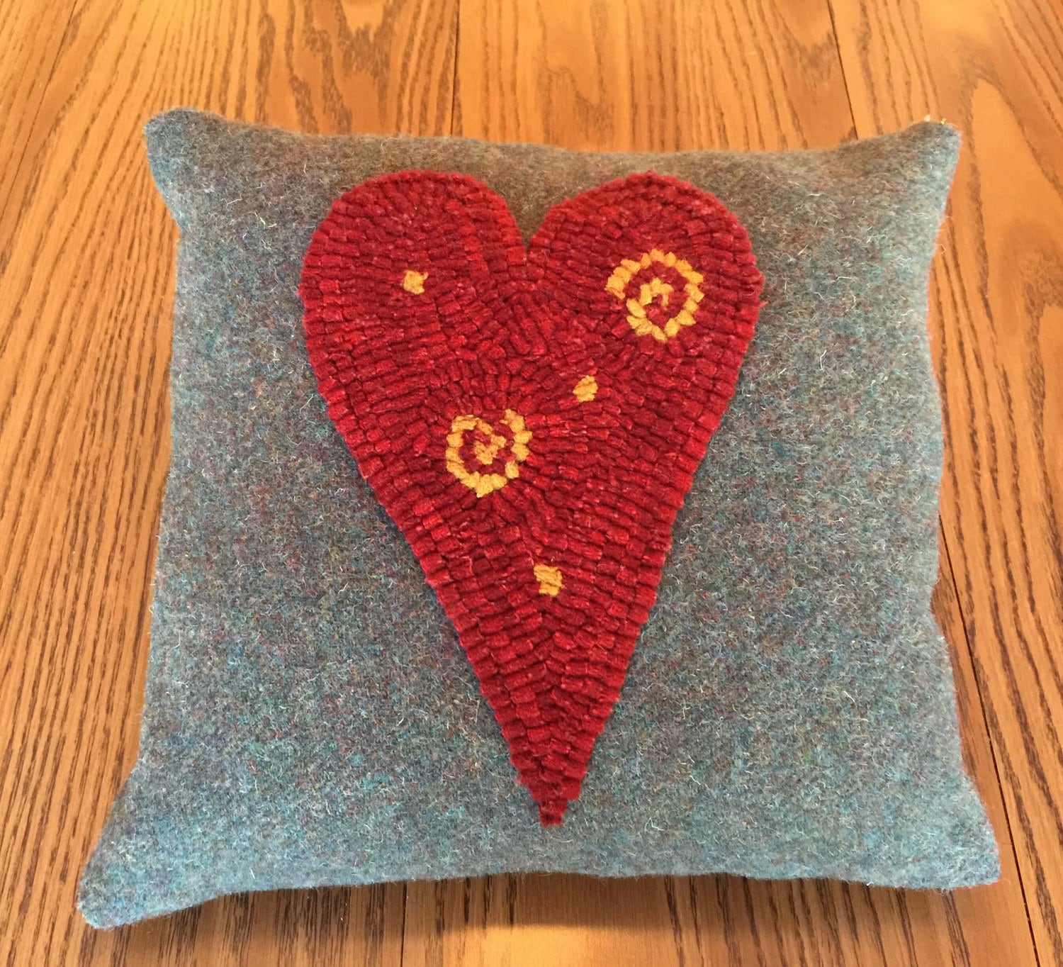 Primitive heart pillow rug hooked