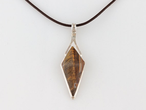 Items similar to Tigereye pyramid cut gemstone set in sterling silver ...