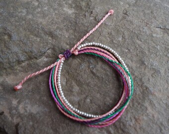 1 wax coated polyester string bracelet with silver seed beads