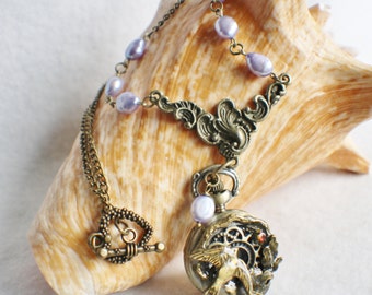 Dove pocket watch pendant with lavender fresh water pearls and crystal on bronze chain